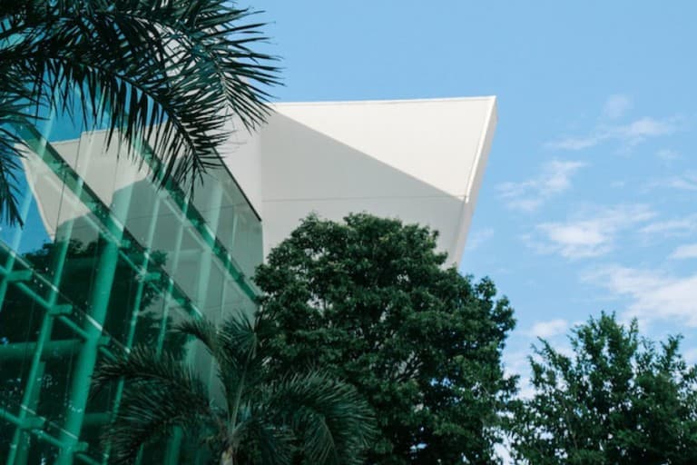 View looking up at some modern offices with trees outside