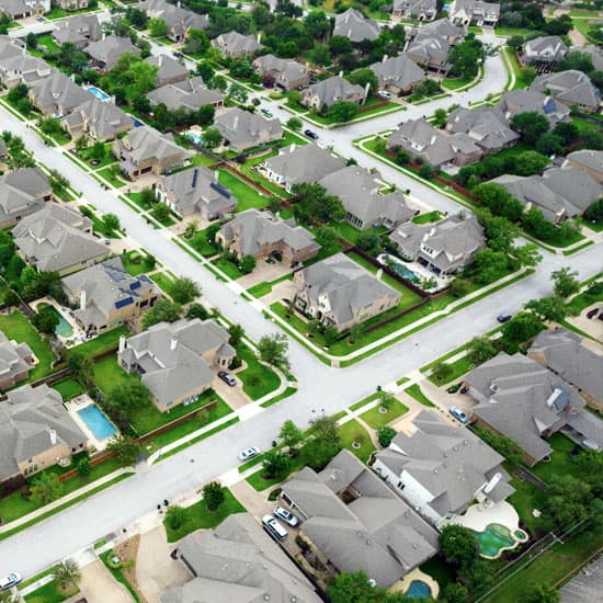 Birds eye view of house estate with lots of green gardens