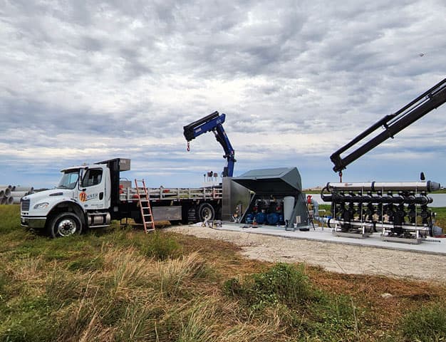 The Hoover team installing a pump station from the truck