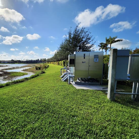 A Hoover Irrigation Pump Station working with green grass around it