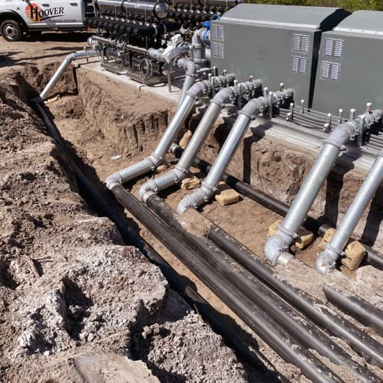 Pipeline being installed into the ground from a Hoover Irrigation Pump System