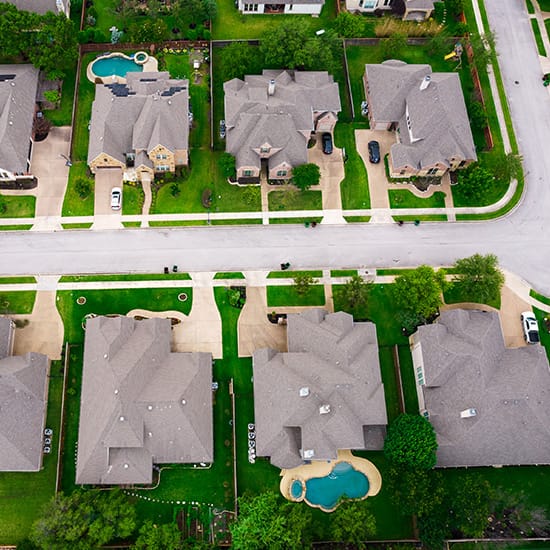 Birds eye view of a housing estate with green gardens