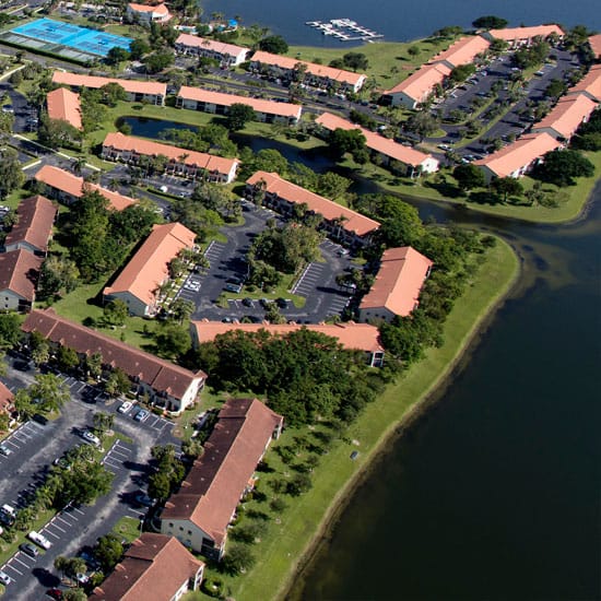 Birds eye view of a housing community estate next to water