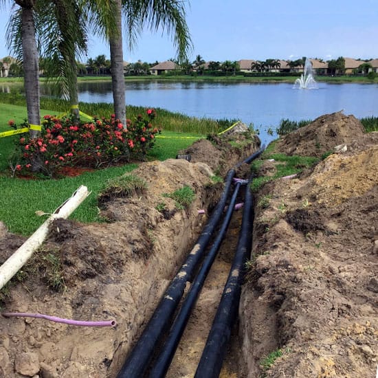 Irrigation pipeline that has been laid into the ground and entering a water resource