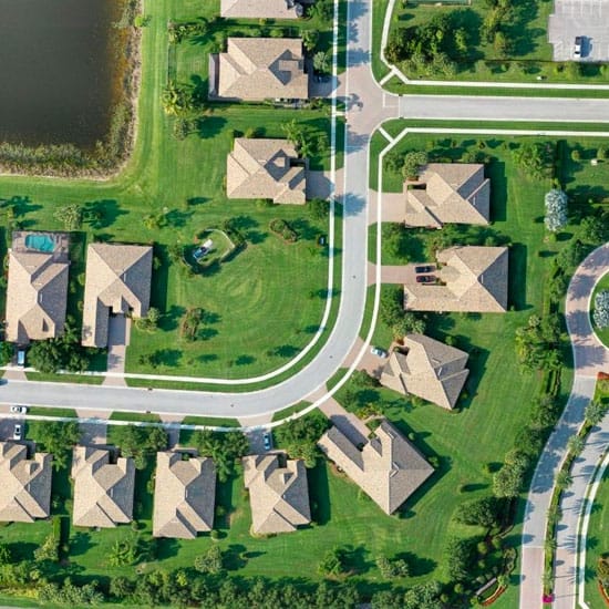 Birds eye view of a housing community to show the state of the grass