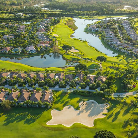 Birds eye view of a housing estate with a golf course